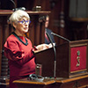 Diana Souhami, author of a Cavell biography, addresses the Senate